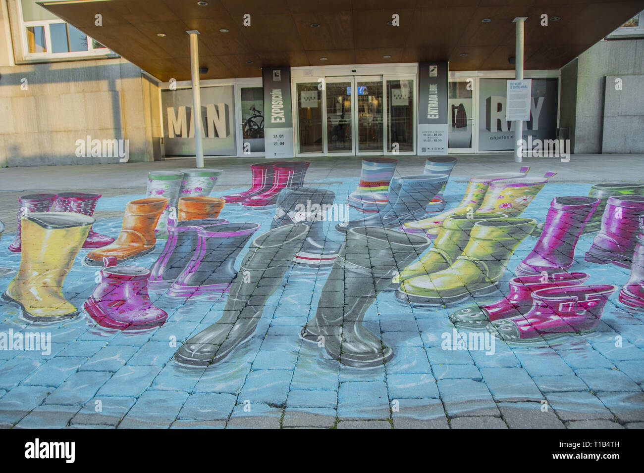 March 25, 2019 - Madrid, Madrid, Spain - International day of water intervention 3d paint art by the artist Leon Keer seen in front of the door of FundaciÃ³n canal in the north of Madrid City..The urban artist Leon Keer from the Netherlands, one of the most outstanding in the international field, has made an ephemeral intervention with his 3D anamorphic graffiti painting. His work makes reference to the different audiences that benefit from the activities of the Foundation, highlighting its variety, but also making them one by being all together. This intervention may be contemplated for sever Stock Photo