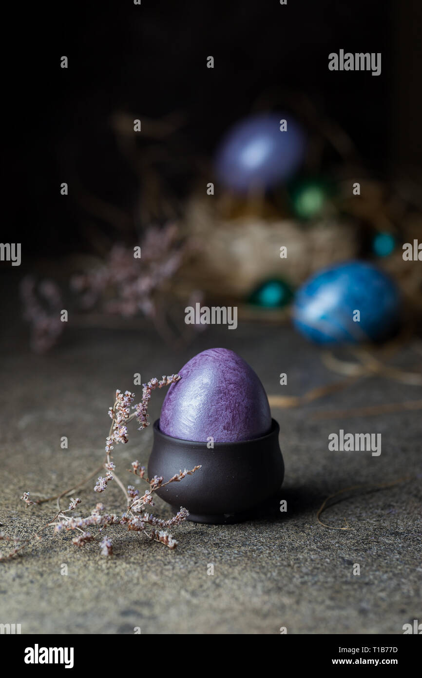 Easter background with painted Easter eggs in vintage style over dark background Stock Photo
