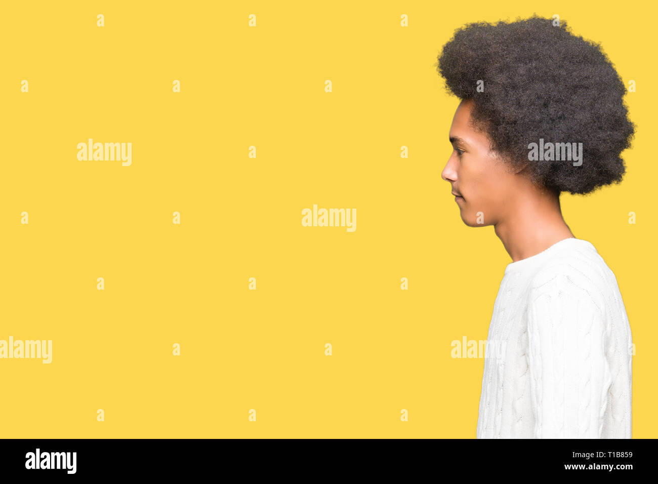 Young African American Man With Afro Hair Wearing Winter Sweater
