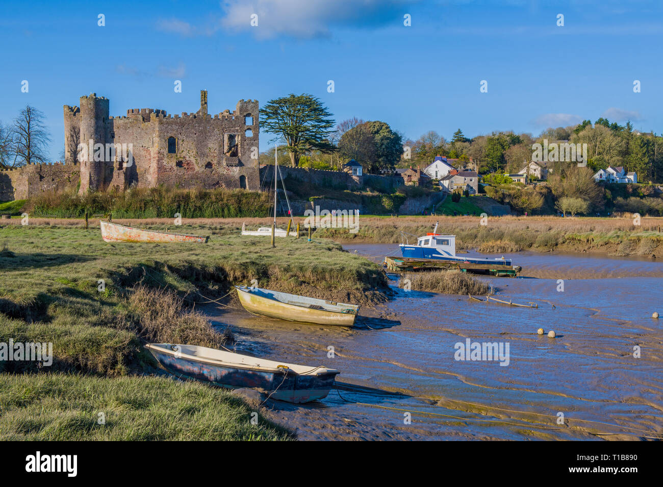 Laugharne Castle Carmarthenshire South Wales. Laugharne was home to Dylan Thomas and is a pretty and peaceful village on the Carmarthenshire coast. Stock Photo