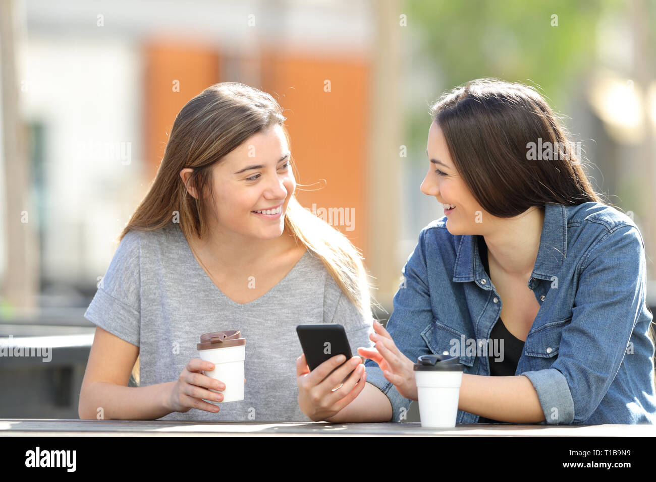 Friends Talking Using Phones Talking On The Phone With Friends