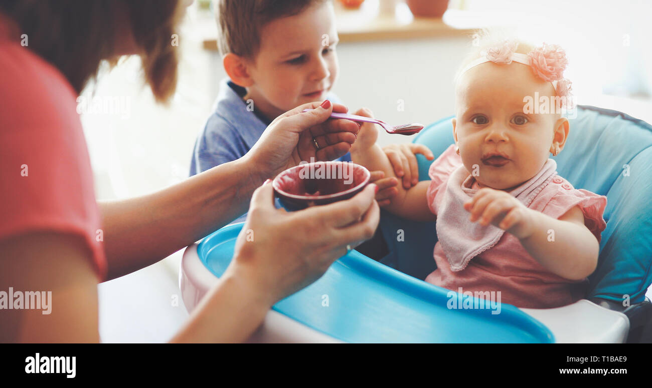 Happy young family, mother with two children Stock Photo