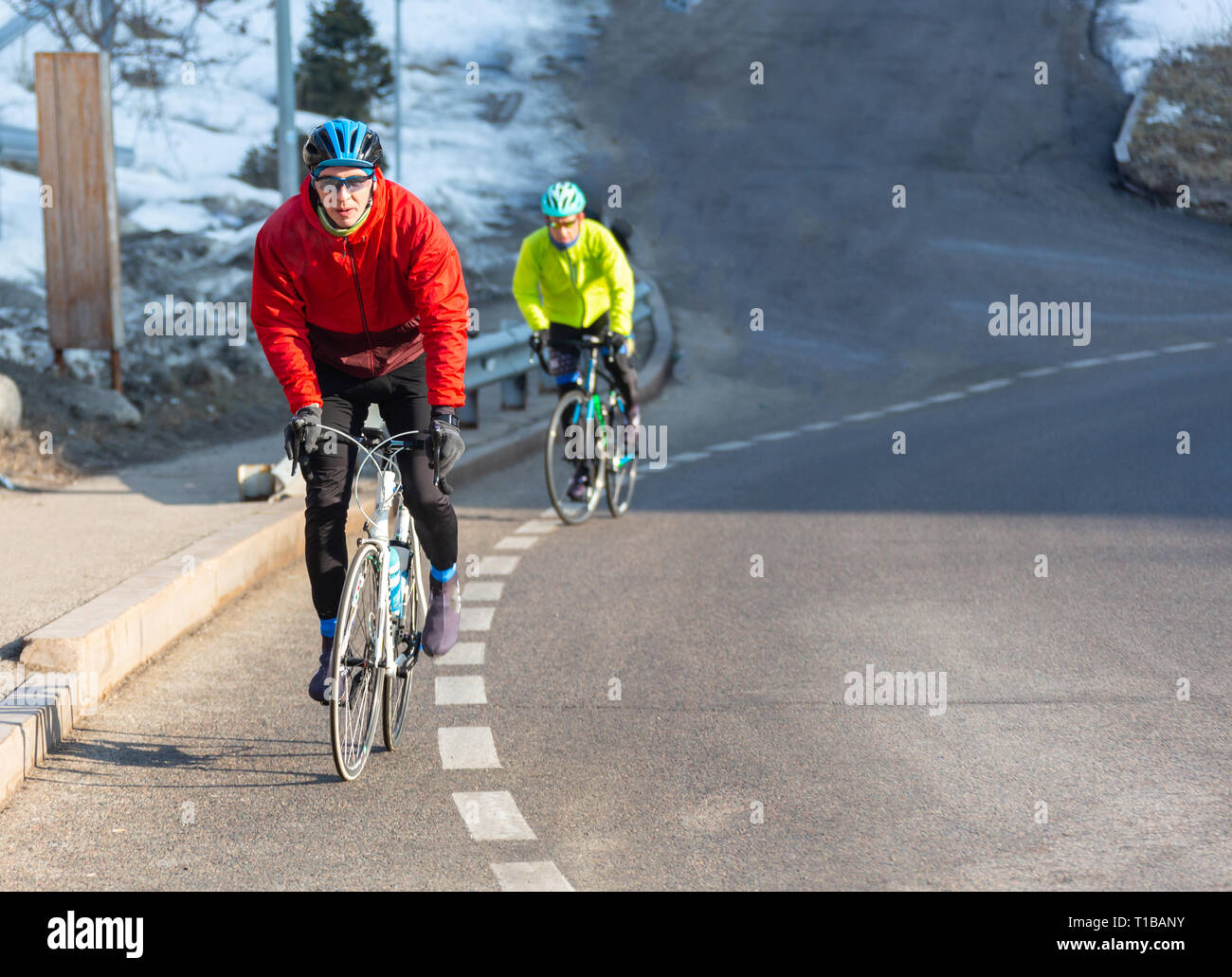 Professional road bicycle racer in action at dawn of the day Stock Photo