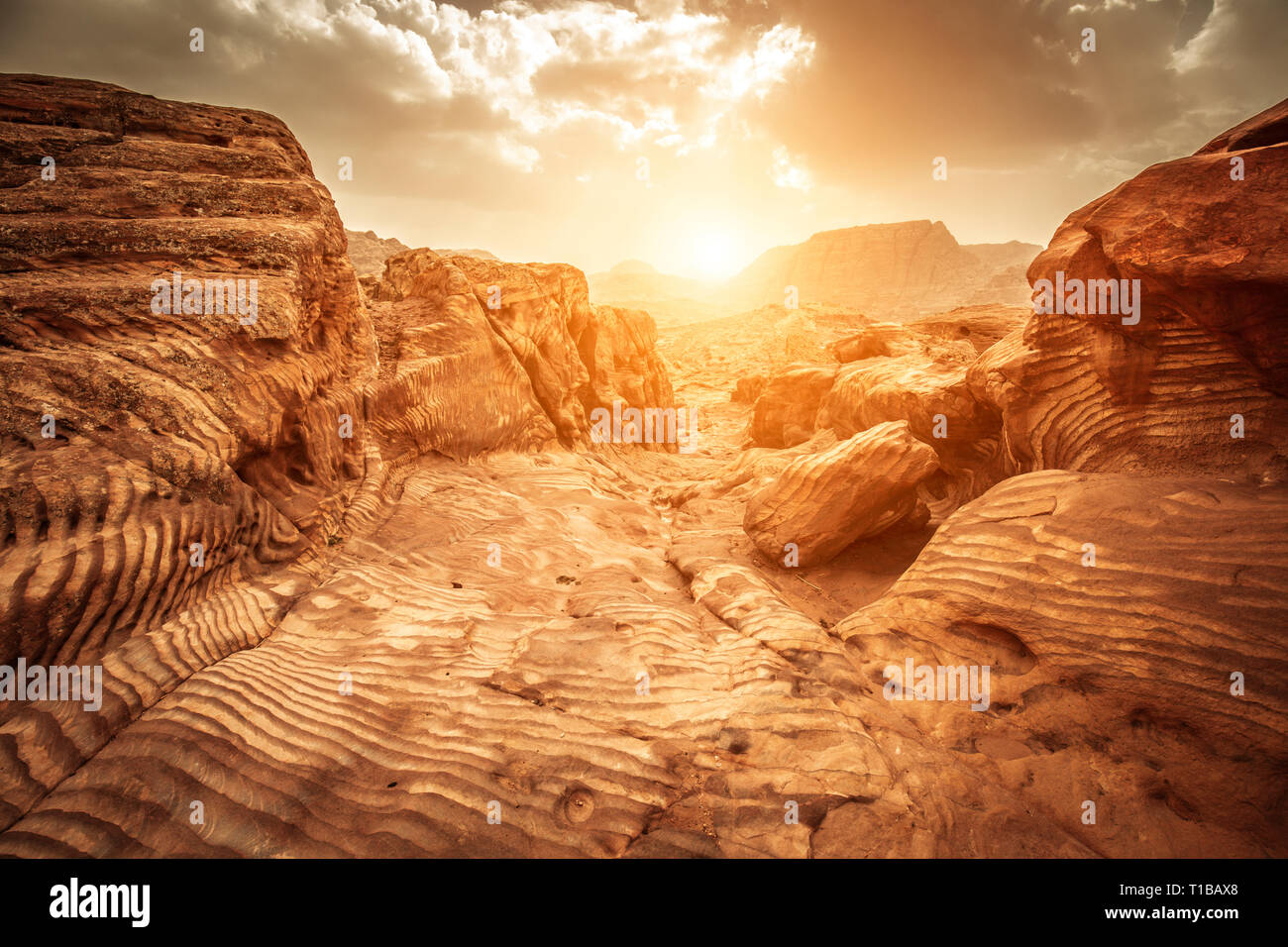 Detail of sandstone rocks in the light of sunset, path of the Nabataeans, picturesque landscape located in Petra, Jordan. Stock Photo