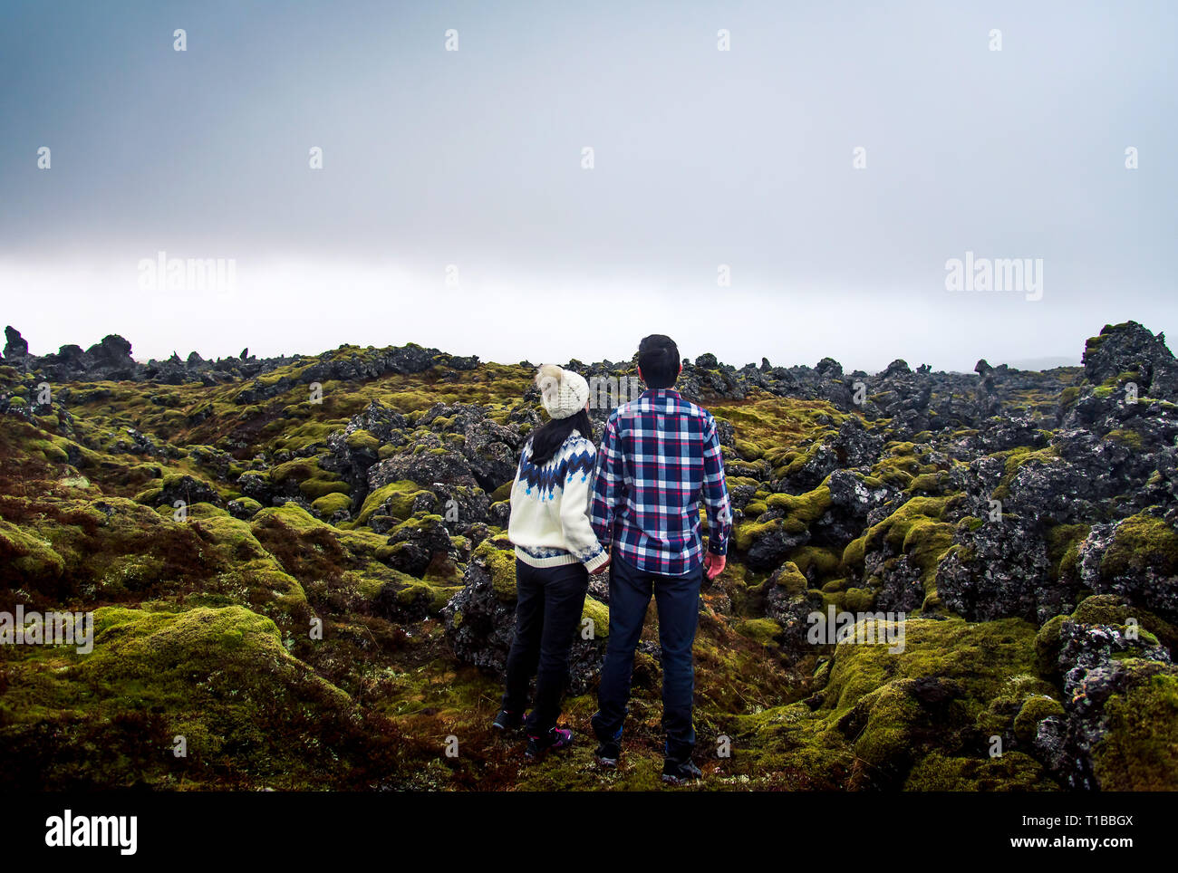 Couple enjoying lava field scenery in Iceland Stock Photo