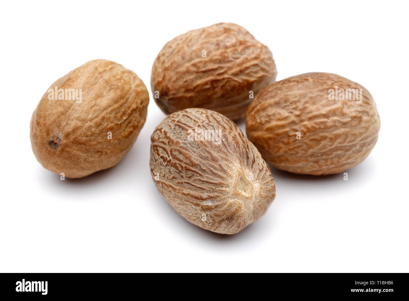 Group of whole nutmeg isolated on white background Stock Photo Alamy