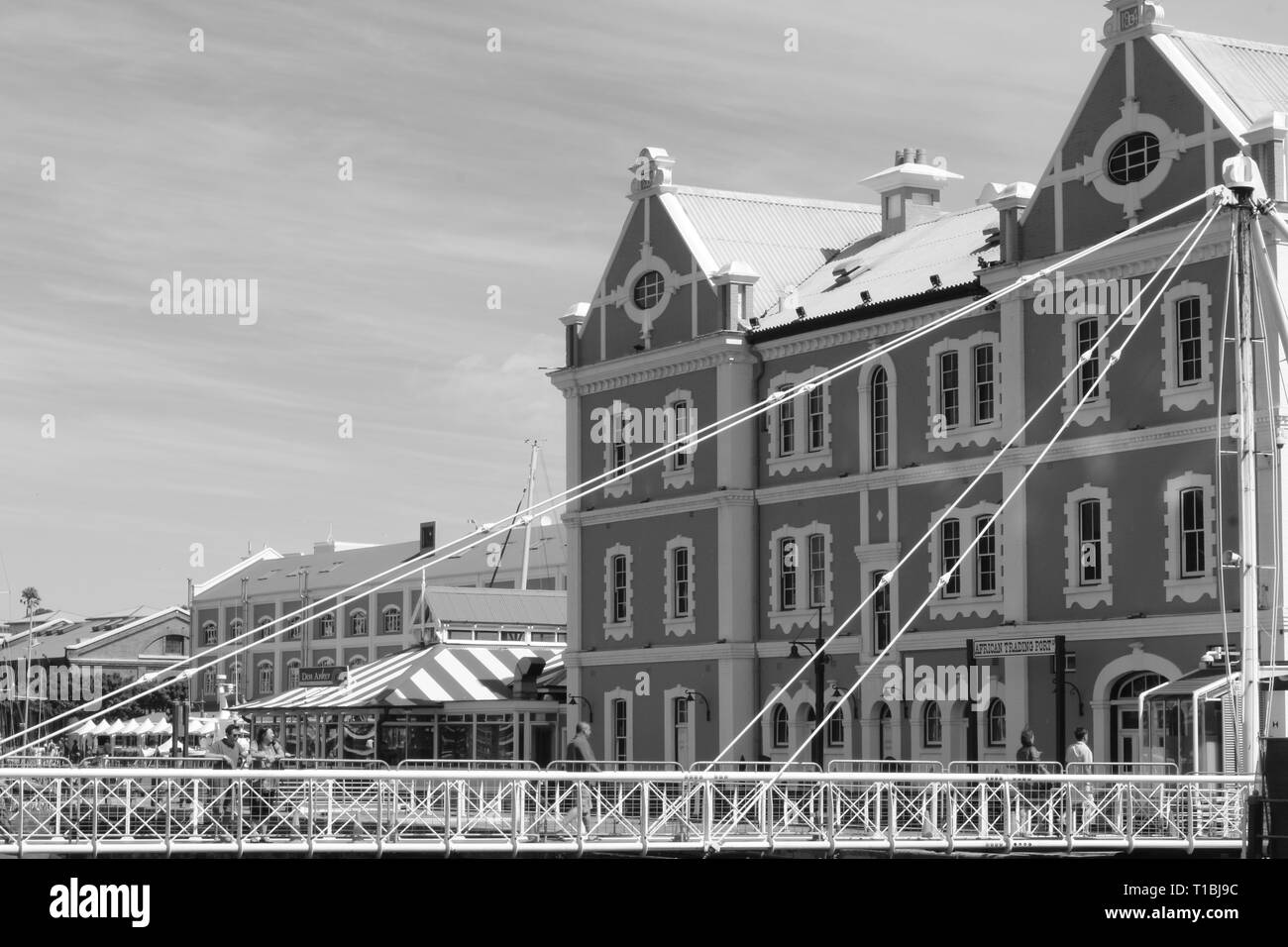 African Trading Post Building With Swinging Bridge at the V&A Waterfront Cape Town South Africa in Back & White Stock Photo