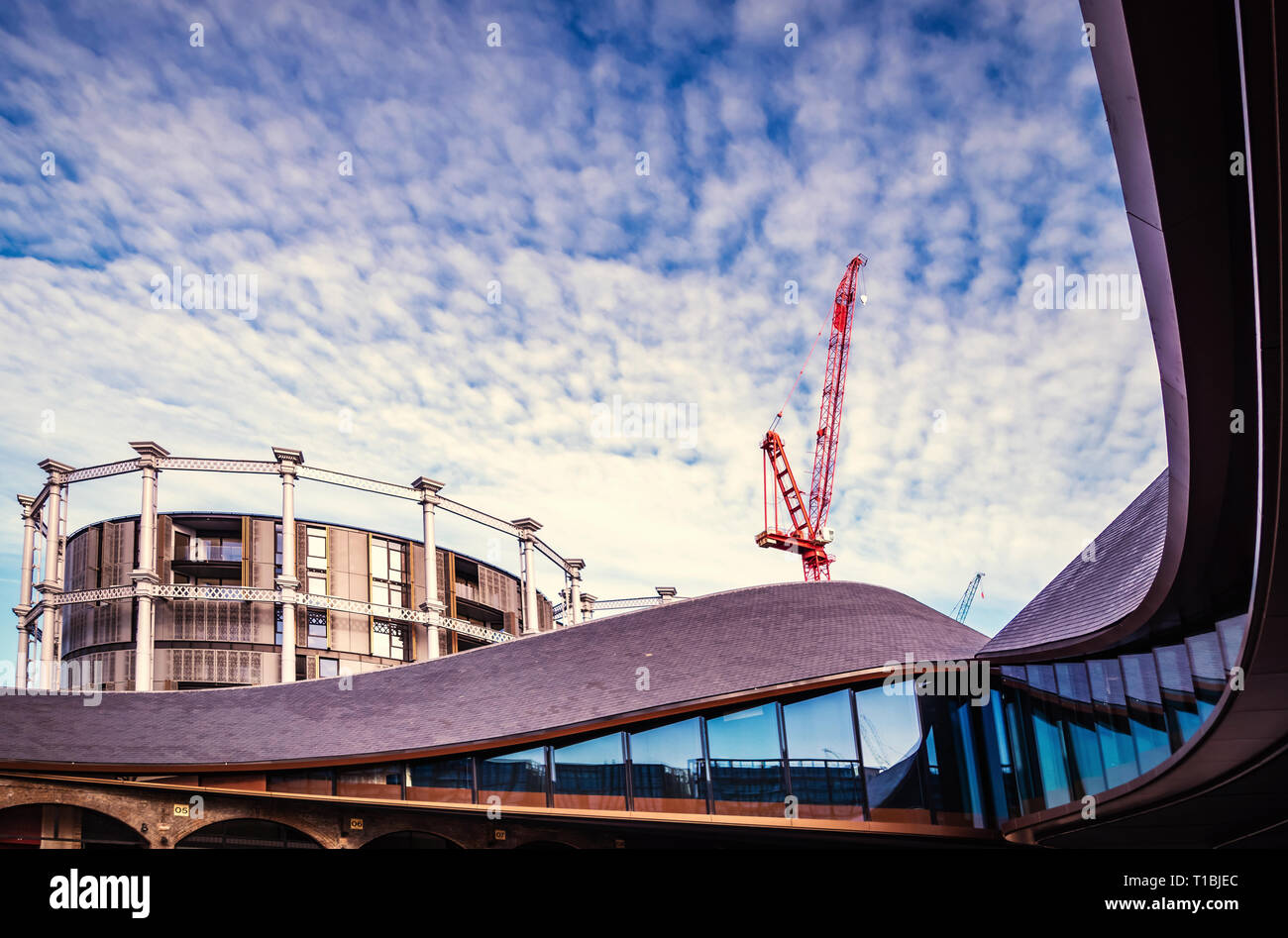 Coal Drops Yard, with its Inception-style roofs, is a retail development in the King's Cross Central scheme and the Gasholders Contemporary Apartments Stock Photo