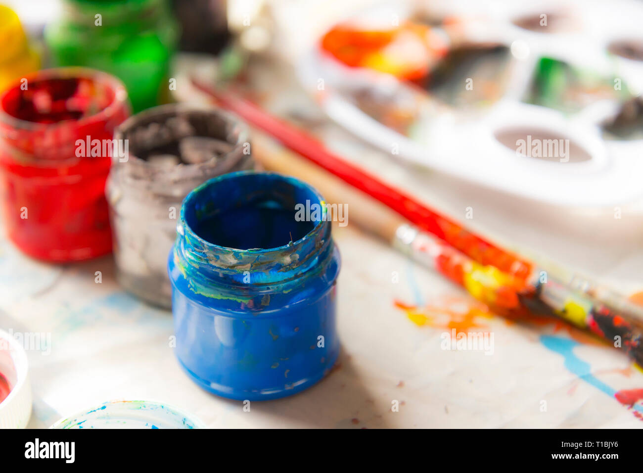 Paint and brushes for kid art and craft Stock Photo