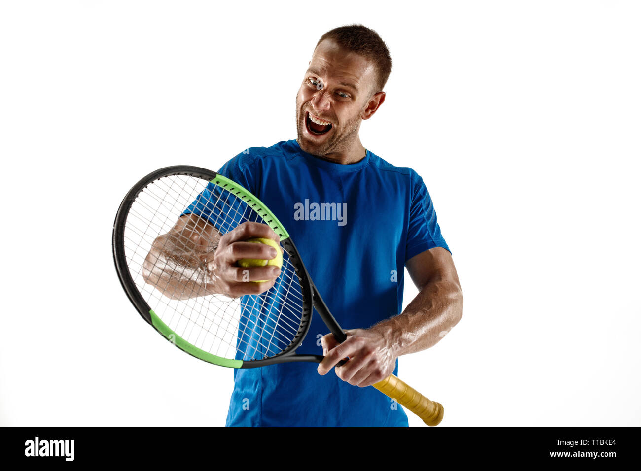 Stressed tennis player throwing and breaking a racket in anger and rage