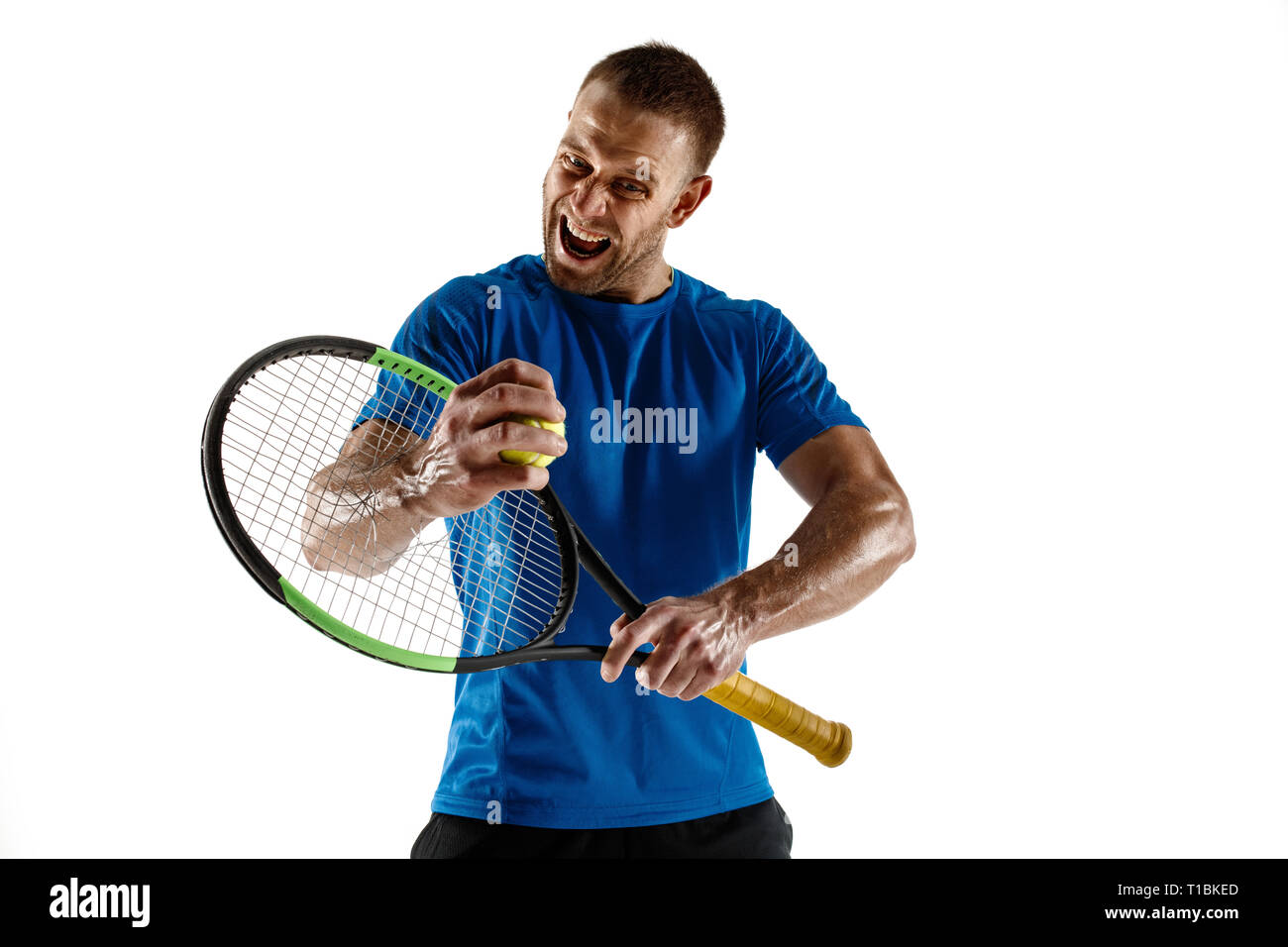 Stressed tennis player throwing and breaking a racket in anger and rage
