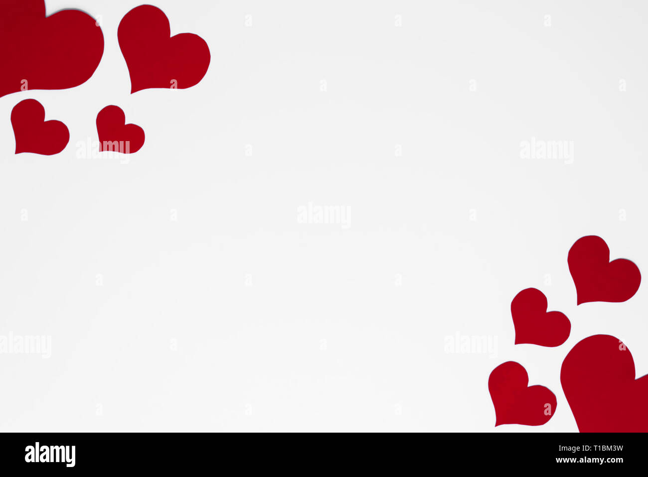 Romantic and simple frame arranged from red hearts on white background ...