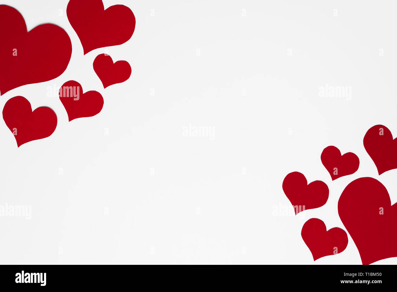 Romantic and simple frame arranged from red hearts on white background ...