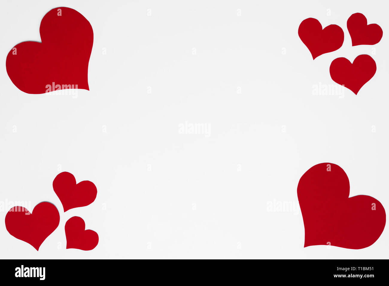 Romantic frame from red hearts on white background with copy space for ...
