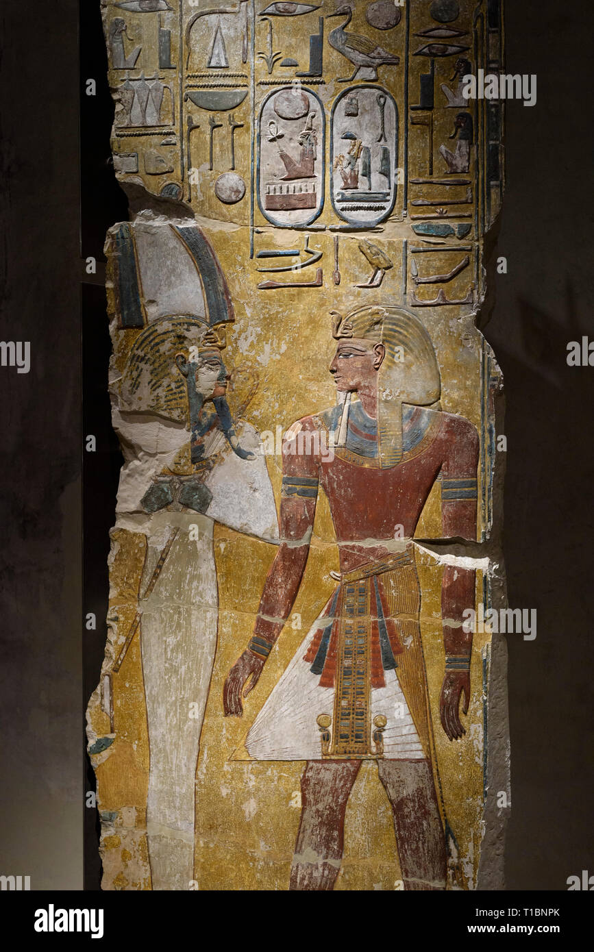 Berlin. Germany. Ancient Egyptian painted fragment of a pillar depicting King Seti I in front of the god Osiris. New Kingdom Period, 19th Dynasty, ca. Stock Photo