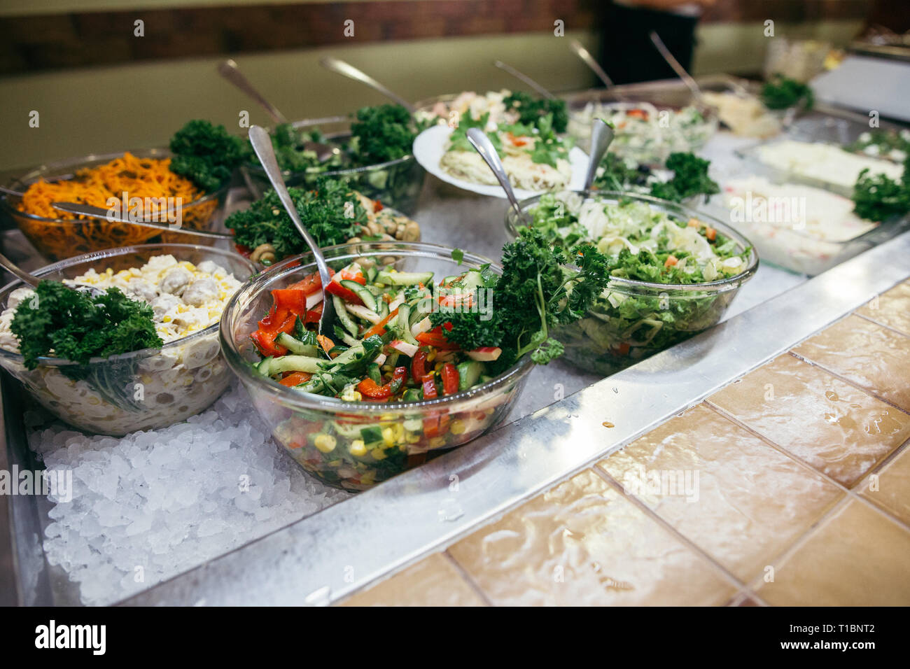 Greek food background. Greek salad, assortment of feta, olives and vegetables. Traditional greek dishes set. Space for text. Food for share Stock Photo