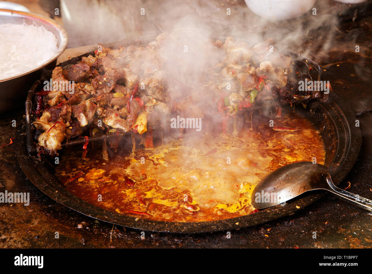 Meat stew on street food court in  Kashgar Old Town, Xinjiang Autonomous Region, China. Stock Photo