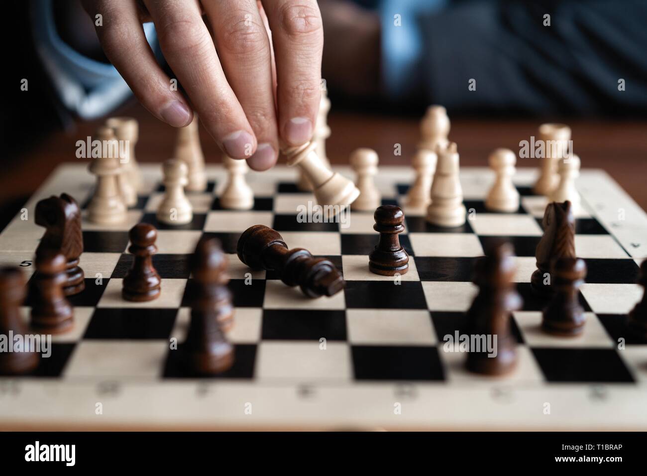 Businessman play with chess game. concept of business strategy and tactic Stock Photo