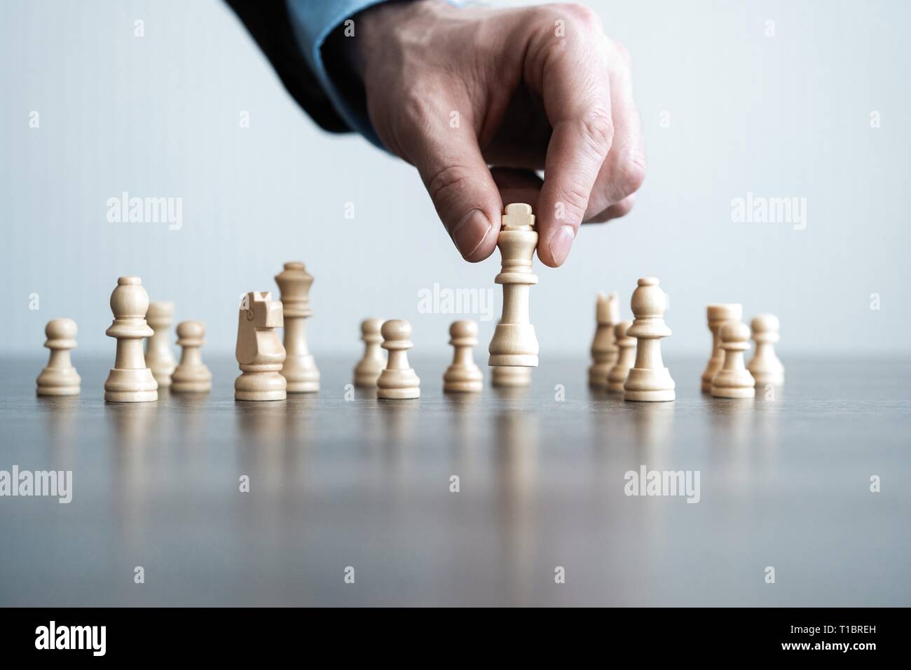 Children's Restraining Hand Thoughtfully Figure Before The Next Chess Move  Stock Photo, Picture and Royalty Free Image. Image 77247675.