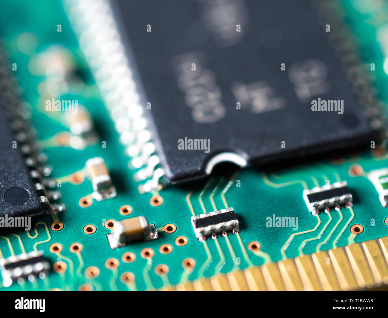 closeup of a circuit board with integrated circuits, resistors, and