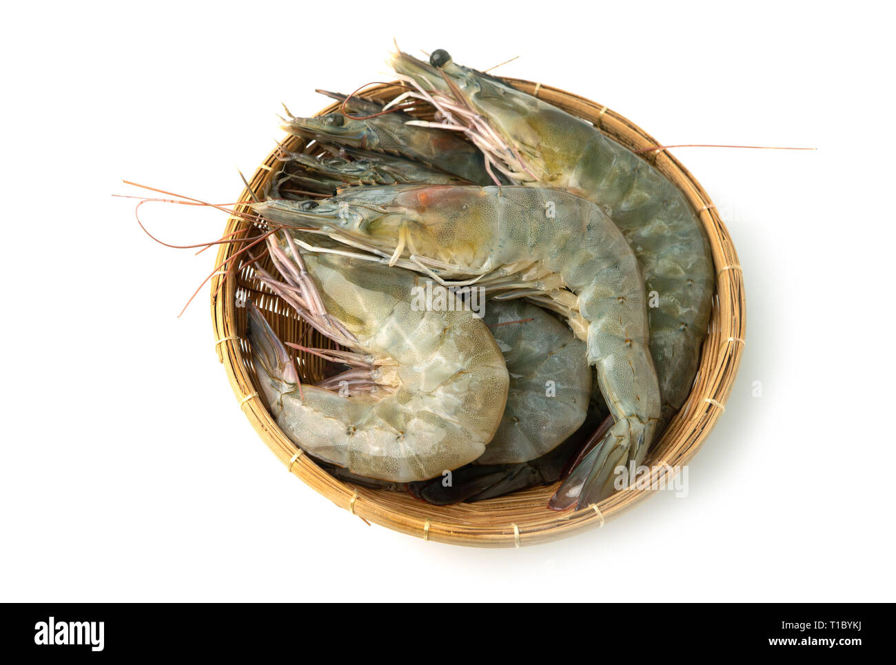 close up group of fresh raw pacific white shrimp in bamboo bowl on white background (Isolated background). Stock Photo
