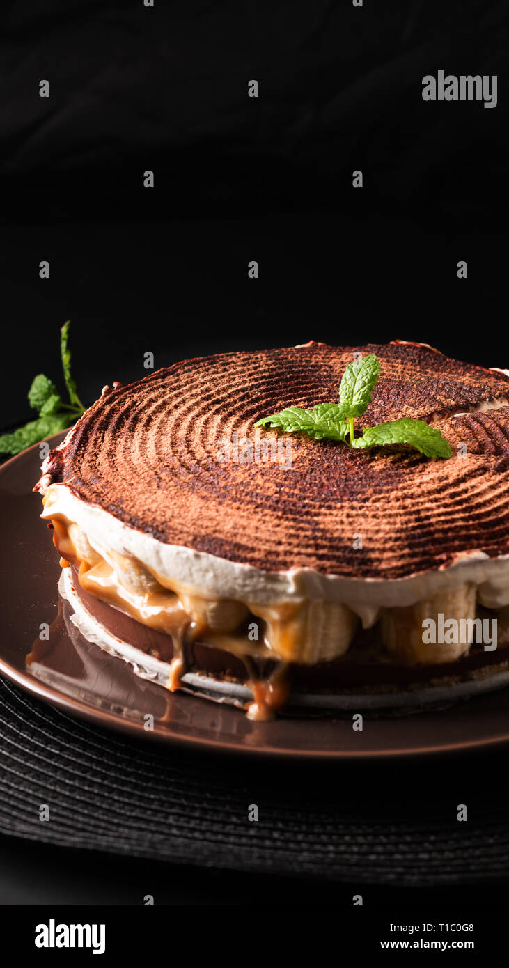 Food dessert concept homemade banoffee pie on black background Stock Photo