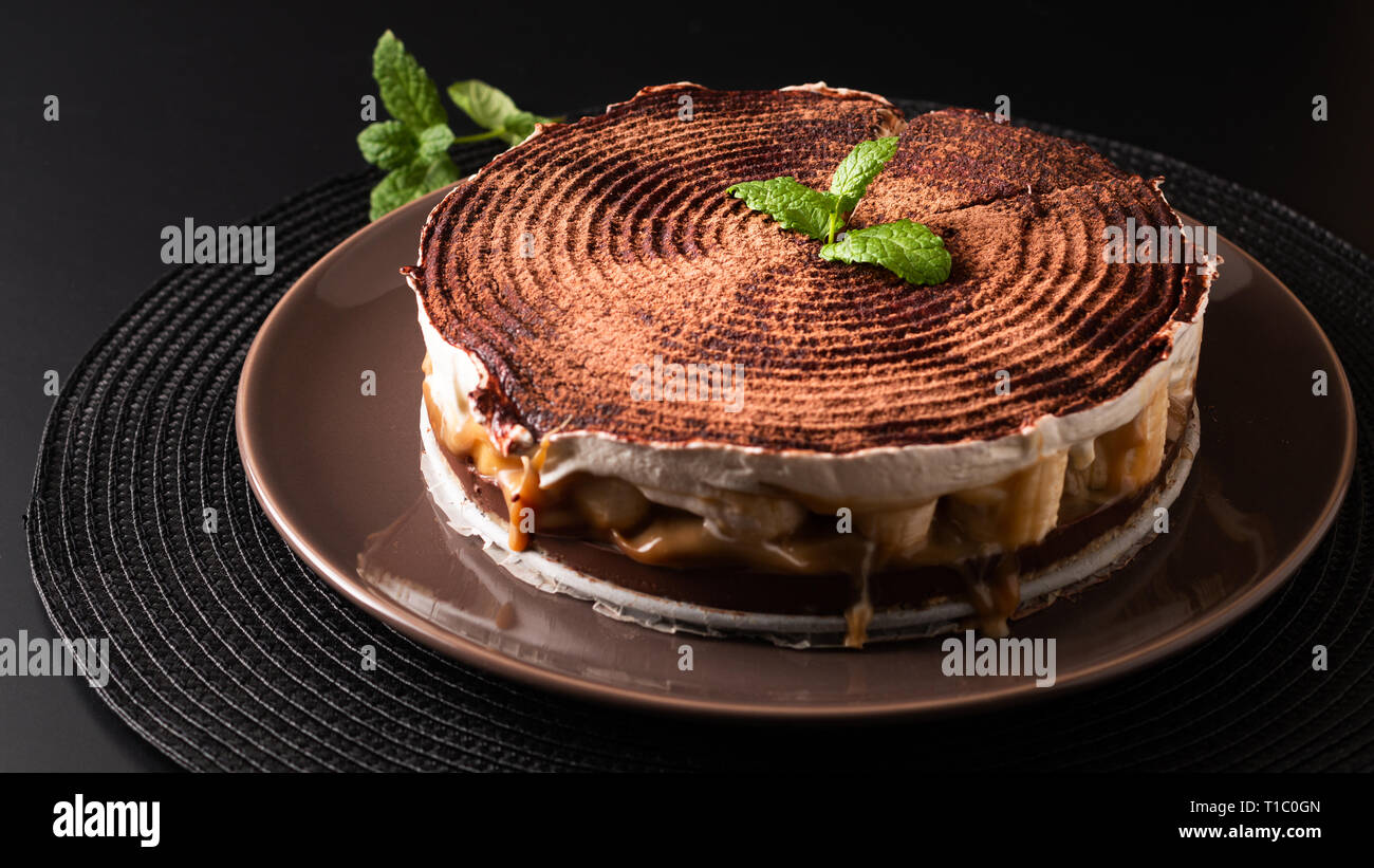 Food dessert concept homemade banoffee pie on black background Stock Photo