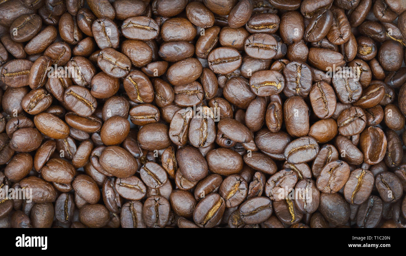 Brown roasted coffee beans texture background for food and drink or ...