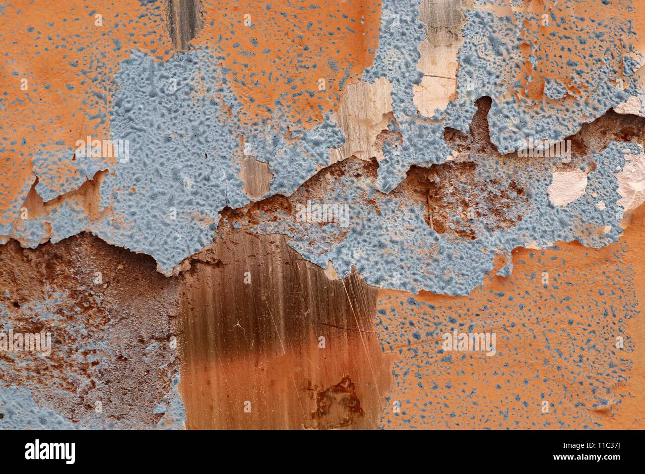Close up detailed surface of weathered paint on different walls in high