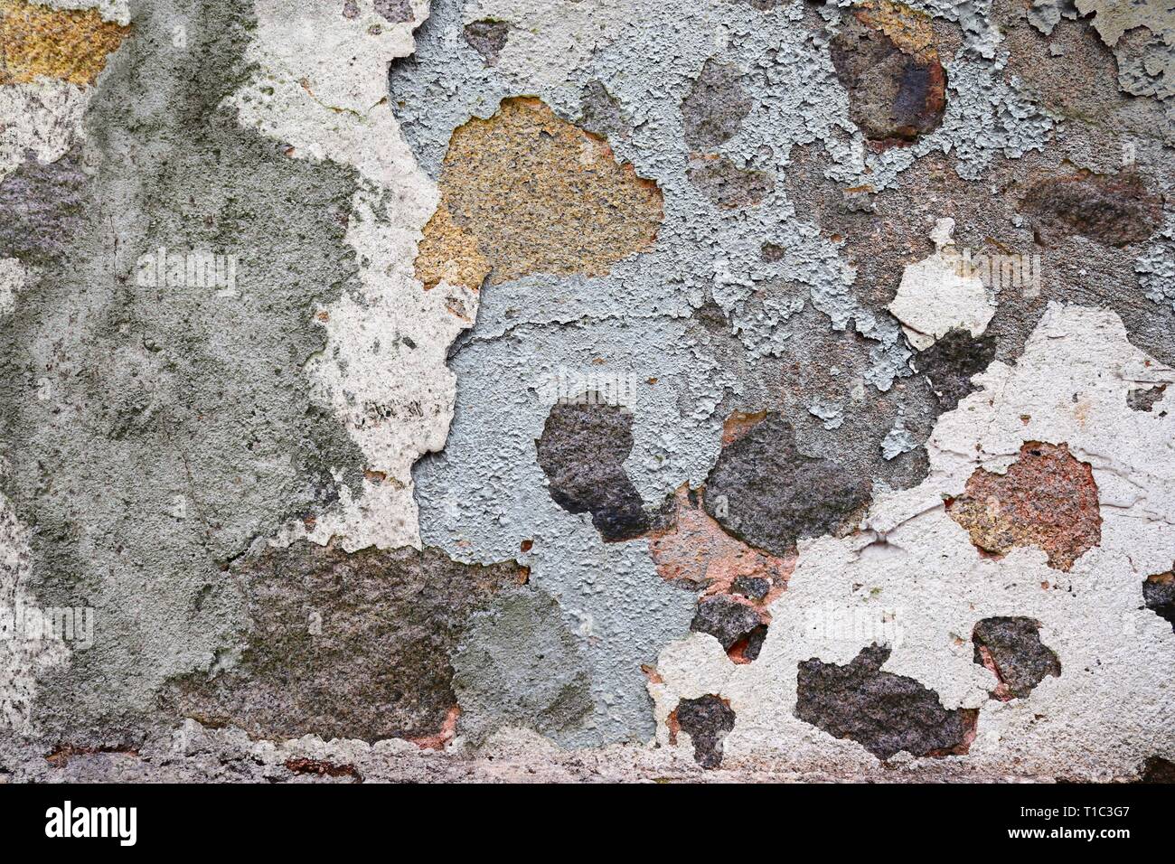 Close up detailed surface of weathered paint on different walls in high