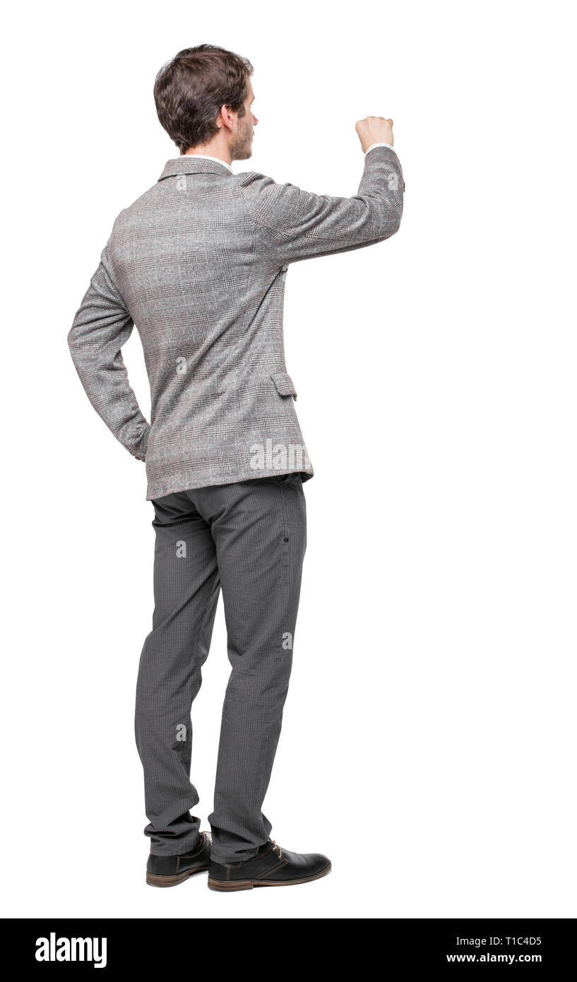 back view of writing business man in suit. Young in draws. Rear view ...