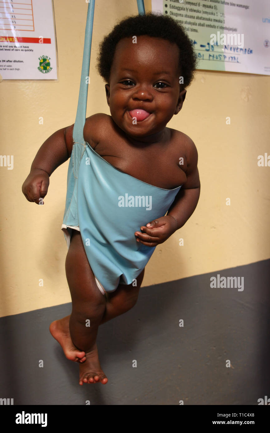 Baby being weighed at a health clinic in Kampala, Uganda Stock Photo ...
