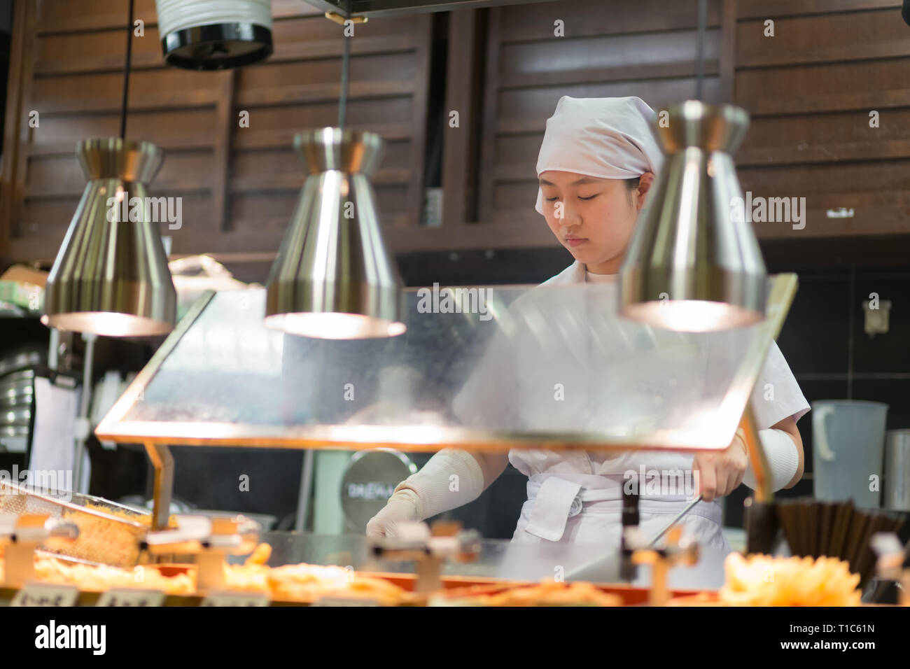 Japanese Ramen chefs prepare a bowl of traditional home made ramen