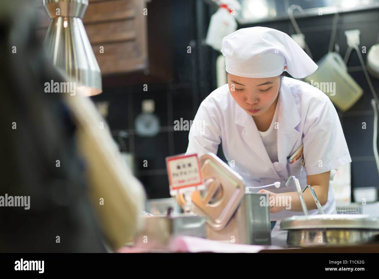 Japanese Ramen chefs prepare a bowl of traditional home made ramen
