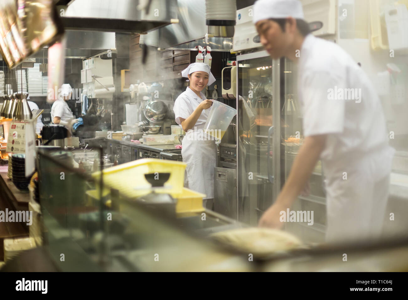 Japanese Ramen chefs prepare a bowl of traditional home made ramen