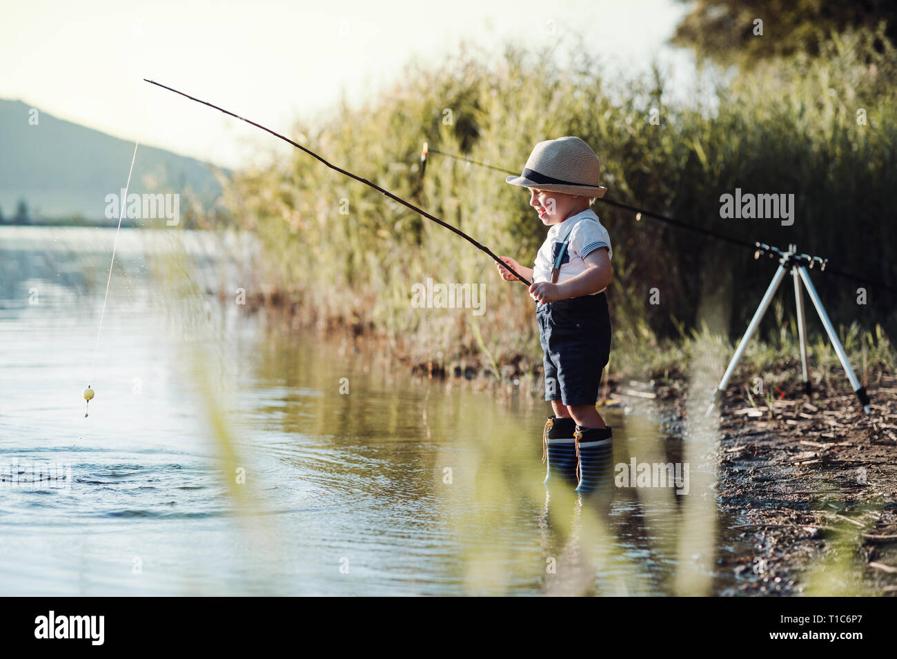 Small boy fishing hi-res stock photography and images - Alamy