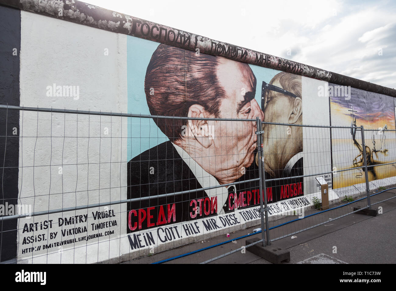 The famous Fraternal kiss graffiti: My God, Help Me to Survive This Deadly Love by Dmitri Vrubel on the Berlin Wall in Berlin, Germany. Stock Photo