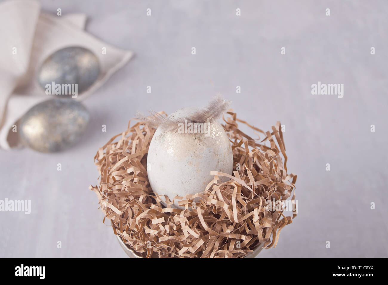 Easter eggs on the table with feather Stock Photo