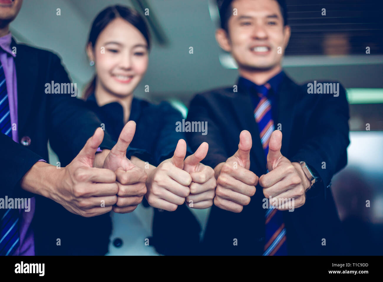 Smiling Happy Businessman And Businesswomen Celebrating Success