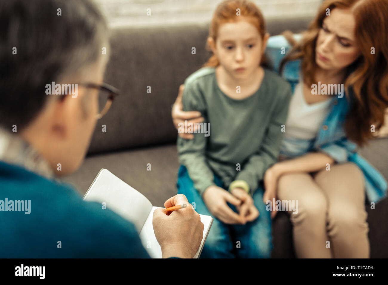 Selective focus of a doctor taking notes Stock Photo