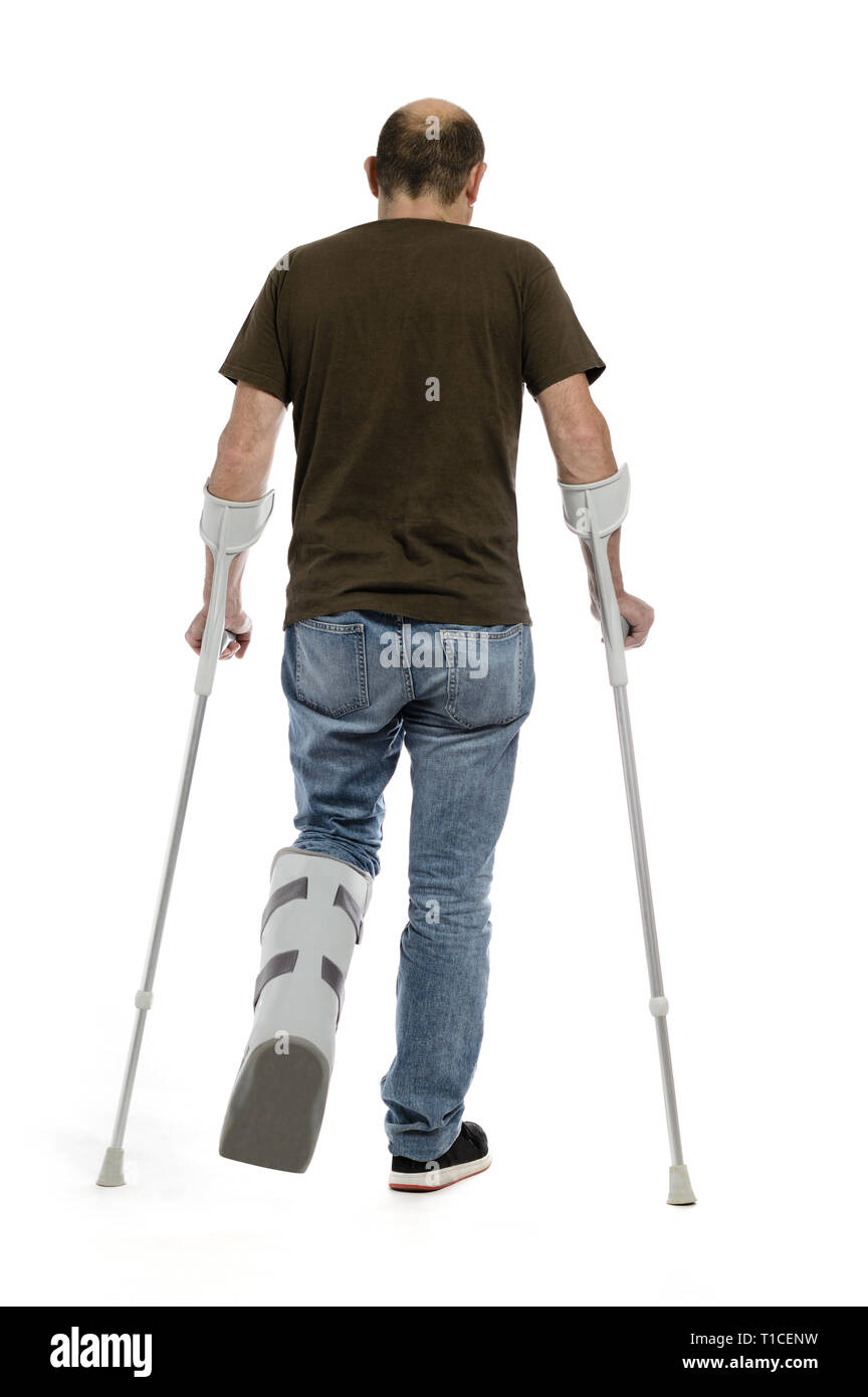 Man with broken leg crutches and orthesis walking backview Stock Photo -  Alamy