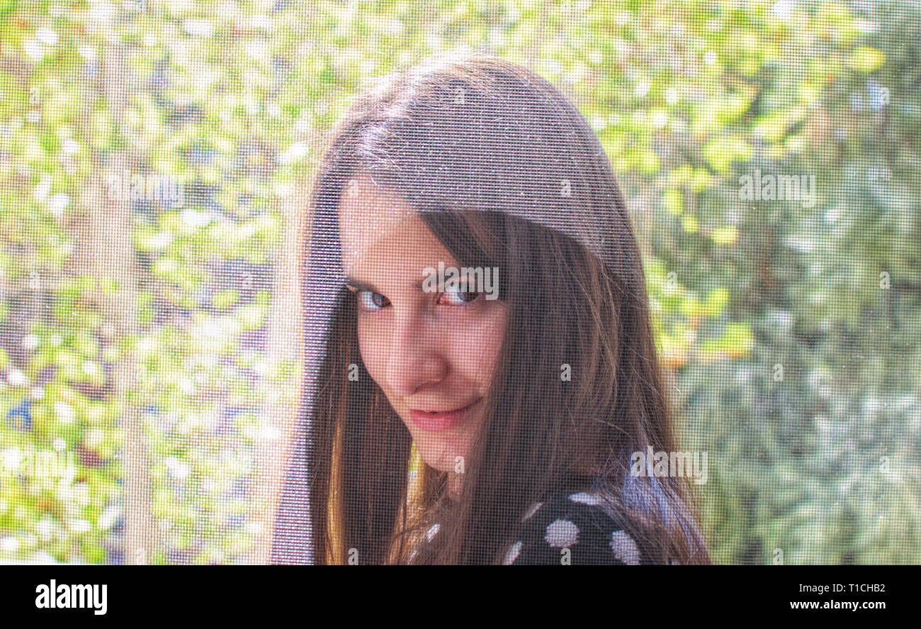 Portrait of a pretty girl smiling and flirting with camera Stock Photo ...