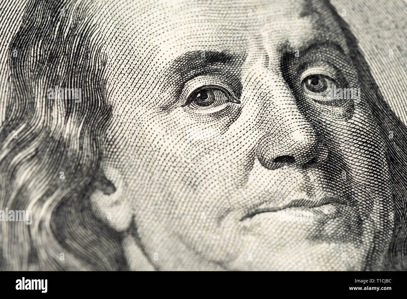 Benjamin Franklin's portrait on one hundred (100) american dollar bill. Macro close up view. Stock Photo