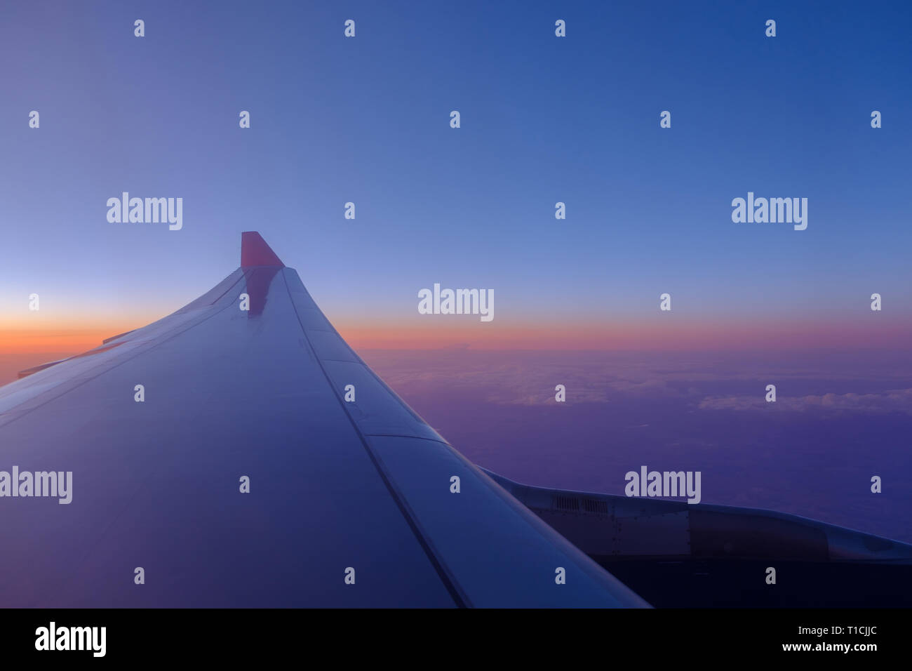 Plane wing fly window sunset hi-res stock photography and images - Alamy