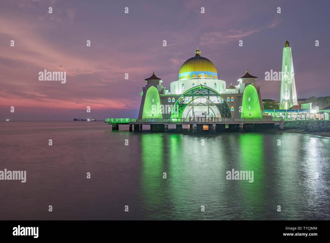 Sunset over Melaka Straits Mosque, located in Malaysia, and built using