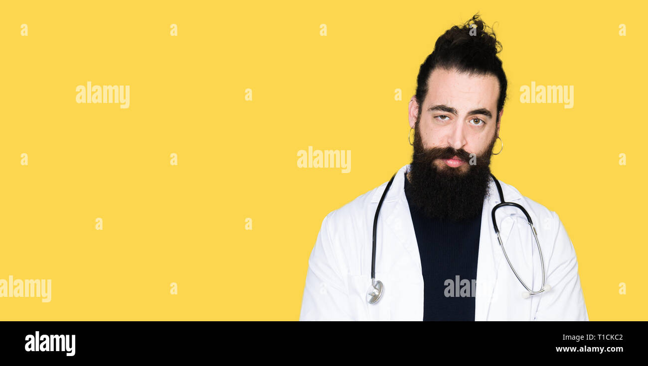 Doctor with long hair wearing medical coat and stethoscope depressed ...