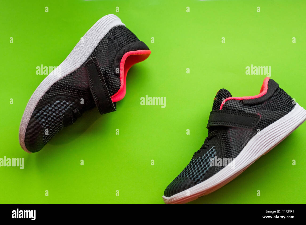Fashion running shoes ,kids Sport shoes.children sports sneakers of black  color, casual shoes isolated on green.Sport spring summer girl shoes Stock  Photo - Alamy