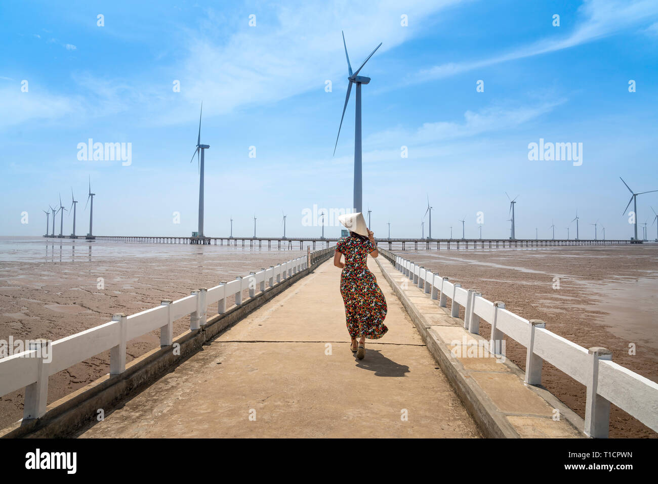 Wind turbines generating electricity on the sea at Bac Lieu, Vietnam - January 26, 2019: Seascape with Turbine Green Energy Electricity, Windmill for Stock Photo
