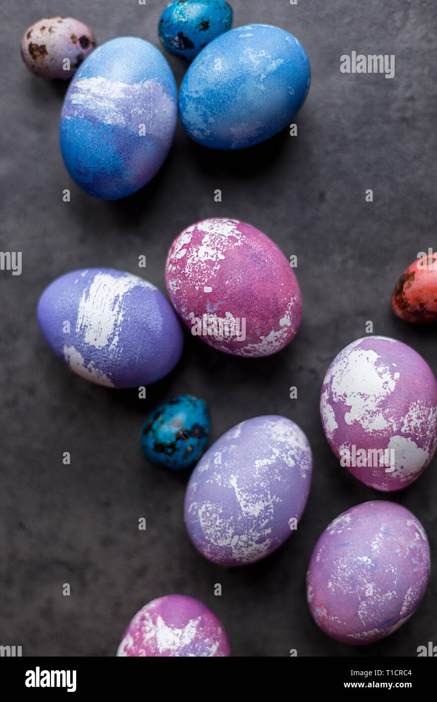 Colorful Easter chicken eggs on dark background. Concept of Easter painted eggs Stock Photo