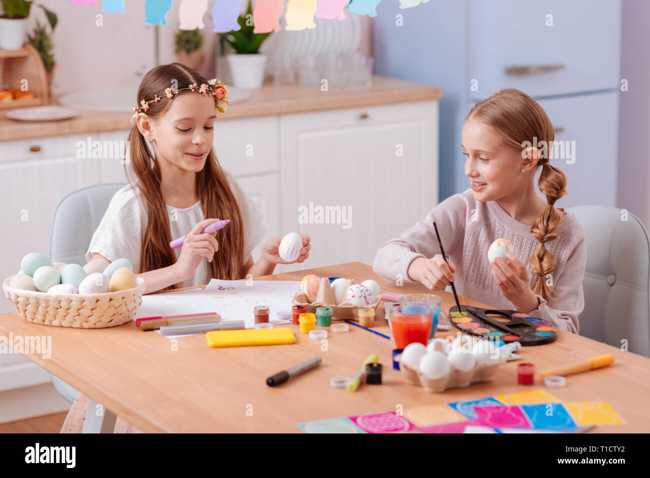 Friendly sisters spending weekend together at home Stock Photo